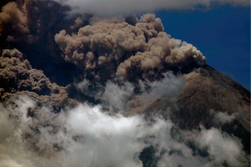 Volcanic ash spews from the Volcan de Fuego after the long-simmering volcano erupted, forcing the evacuation of more than 33,000 people from surrounding communities.