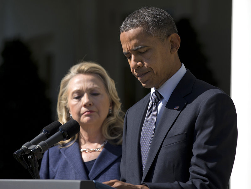 President Obama, accompanied by Secretary of State Hillary Rodham Clinton, speaks in the Rose Garden of the White House in Washington about the death of U.S. ambassador to Libya Christopher Stevens.