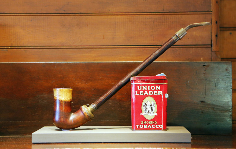 Homer's studio resonates with echoes of the artist's presence, including this pipe and a tin of tobacco, which rest atop the mantel in the parlor.