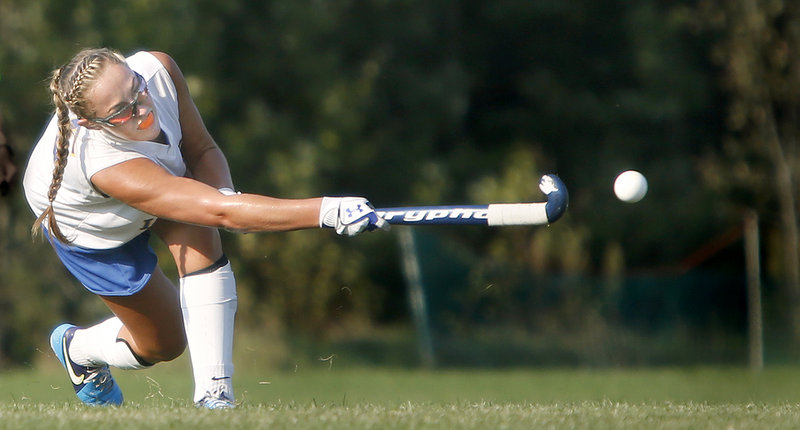 Kayleigh Lepage of Lake Region strikes the ball during Friday’s Western Maine Conference field hockey game against Cape Elizabeth. The Lakers improved to 6-0 with a 3-2 overtime victory.