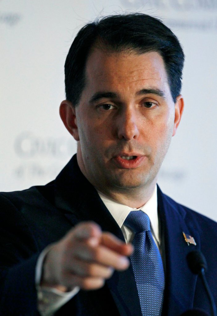 Gov. Scott Walker speaks at a news conference in June. A judge threw out a law ending most collective bargaining rights for public workers.