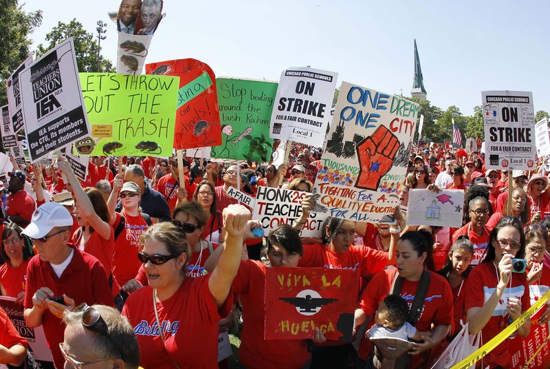 Striking Chicago teachers rally at Union Park on Saturday. Union President Karen Lewis said there is a “framework” for an end to the walkout, but the teachers are still on strike.
