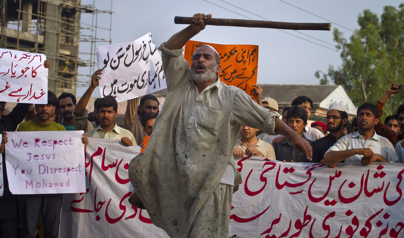 A Pakistani man shouts anti-U.S. slogans at a rally Saturday in Islamabad. For the most part, protests over an anti-Muslim film that swept 20 countries last week had eased, but not before leaving at least eight protesters dead and hundreds arrested.