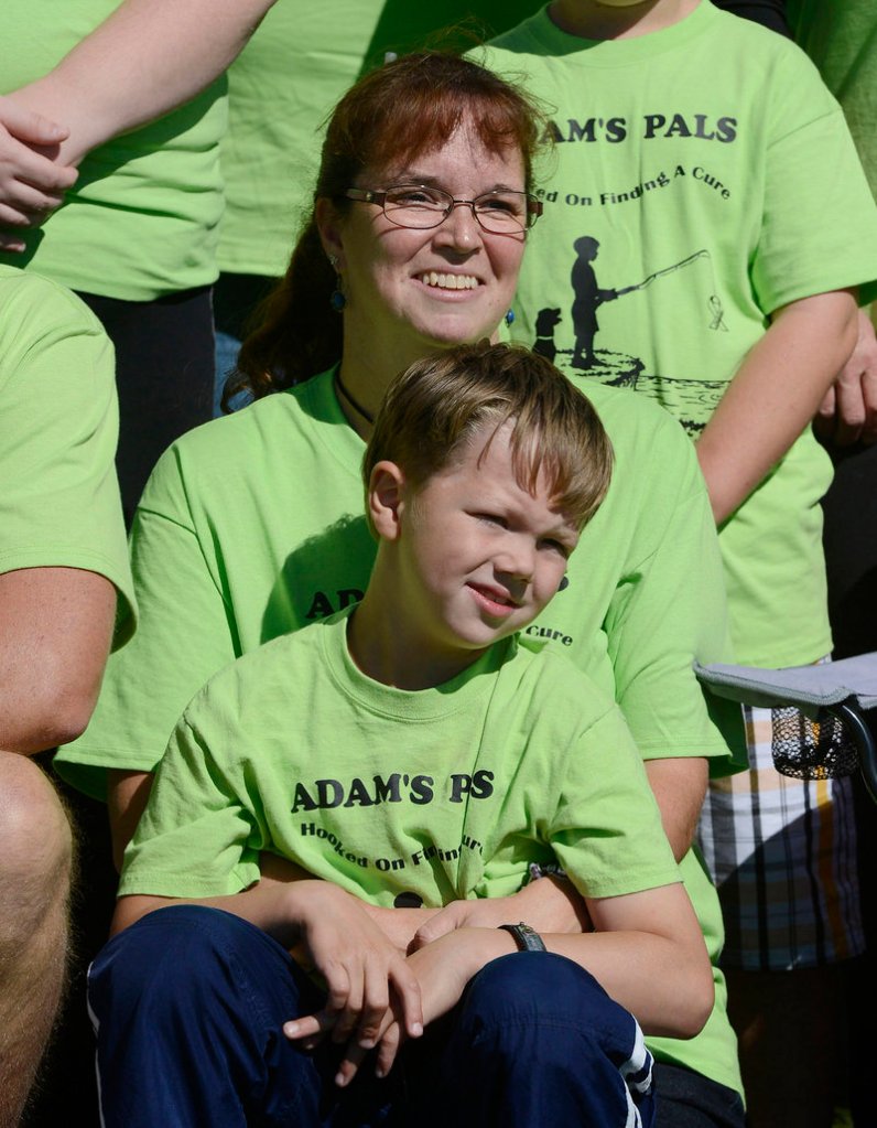 Amy Jacobson of Cumberland poses for photographs with her son Adam, 7, before the walk at Payson Park in Portland on Sunday. Adam has type 1 diabetes and had a large group – Adam’s Pals – walking on his behalf.