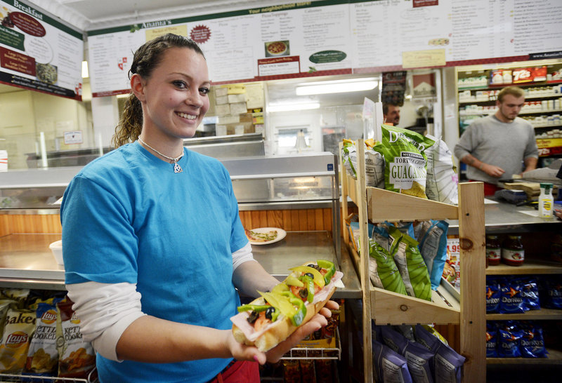 Megan Small shows off an Italian sandwich at Anania’s on Broadway in South Portland. Anania’s also has locations in Portland – on Washington Avenue and outer Congress Street.