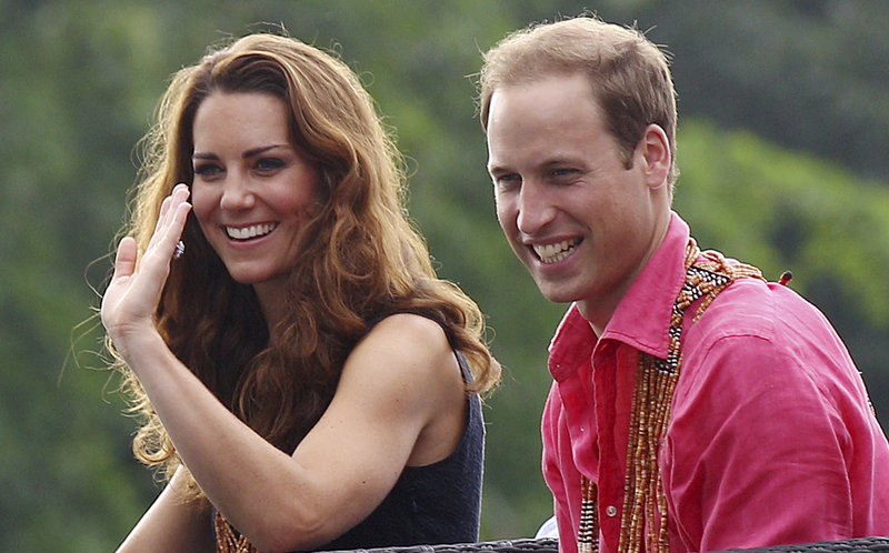 Prince William and his wife, Kate, smile while watching a shark ceremony in the Solomon Islands on Monday. They’re not smiling, though, over published photos of a certain topless duchess.