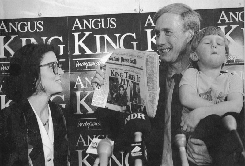 NOV. 9, 1994: Accompanied by his wife, Mary Herman, left, and their son Benjamin, then 4, Angus King holds up a copy of the Portland Press Herald on the day after he was elected governor.