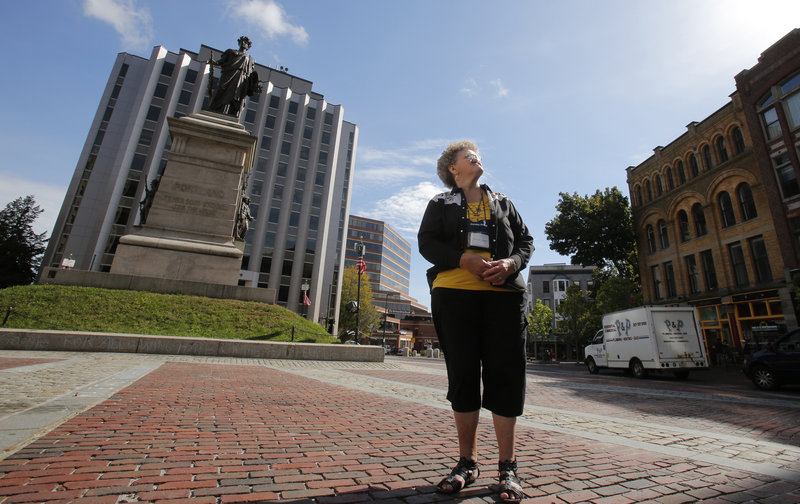 Merna Colwell of Pennsylvania takes in the site from Monument Sqaure in Portland on Tuesday, Sept. 18, 2012. She was exploring Portland with her Howard and their grandson after disembarking from the Carnival Glory cruise ship.