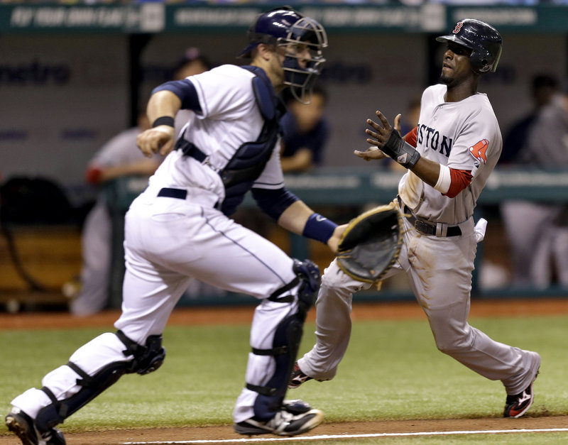 Boston’s Pedro Ciriaco scores past Tampa Bay catcher Chris Gimenez on Dustin Pedroia’s fifth-inning sacrifice fly.