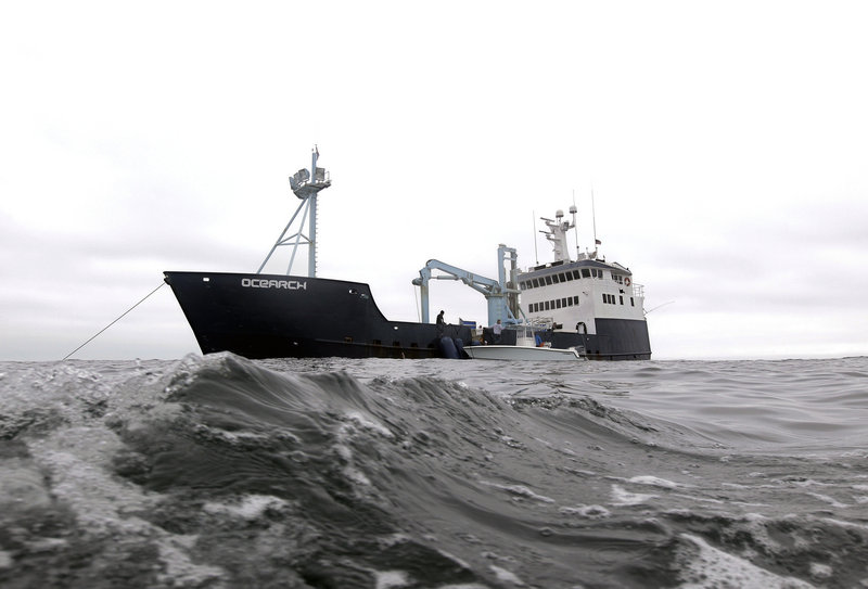 In this Sept. 7, 2012, photo, the research vessel Ocearch has set her anchor as the crew begins their search for great white sharks on the Atlantic Ocean, spending two to three weeks tagging sharks and collecting blood and tissue samples off the coast of Chatham, Mass. The Ocearch team baits the fish and leads them onto a lift, tagging and taking blood, tissue and semen samples up close from the world’s most feared predator. The real-time satellite tag tracks the shark each time its dorsal fin breaks the surface, plotting its location on a map. (AP Photo/Stephan Savoia)