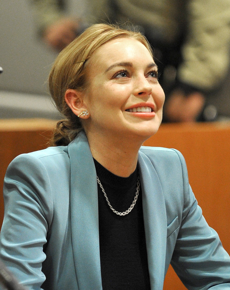 Lindsay Lohan is charged with leaving the scene of an accident in New York.