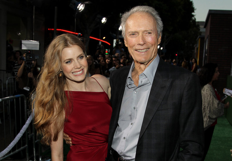 Cast members Clint Eastwood and Amy Adams pose together at the premiere of “Trouble With the Curve” at the Westwood Village Theater in Los Angeles.