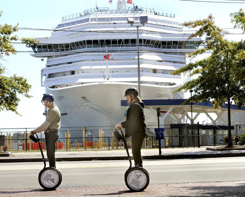 In this Sept. 25, 2012 file photo, a Segway tour passes in front of the Carnival Glory, which was tied up at the Maine State Pier. Friday was the biggest day ever for cruise ships visiting Maine, according to CruiseMaineUSA.