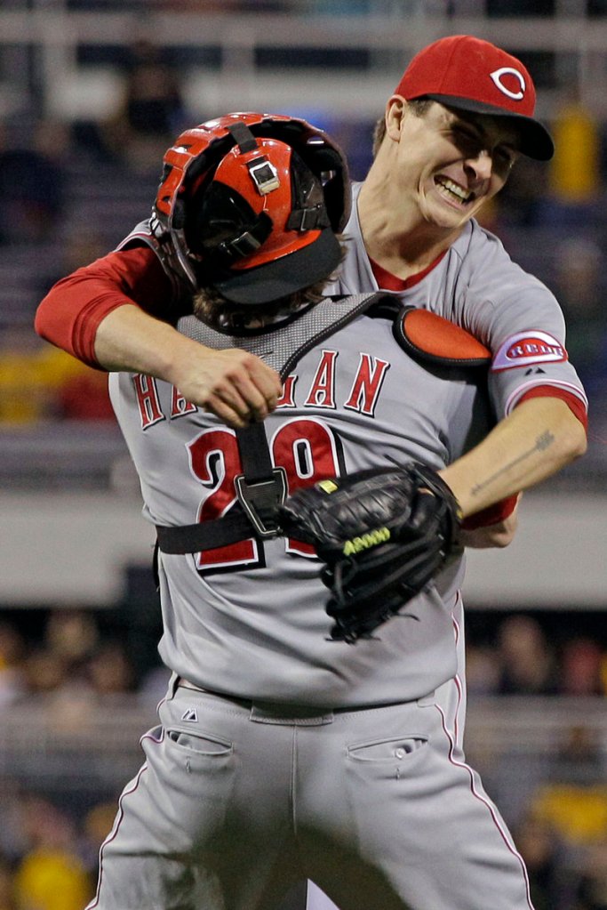 Homer Bailey of the Cincinnati Reds celebrates with his catcher, Ryan Hanigan, after Bailey threw a no-hitter against the Pittsburgh Pirates in Pittsburgh on Friday night.