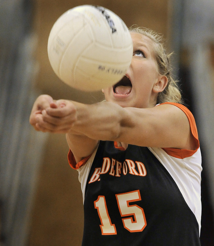 Bailey Cote of Biddeford keeps her concentration and her eyes on the ball Wednesday night while setting up a shot for a teammate during the volleyball match against Greely. Biddeford came away with a three-game victory.