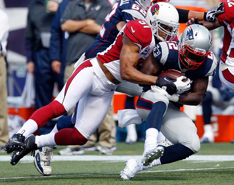 Arizona Cardinals linebacker Paris Lenon tackles New England Patriots running back Stevan Ridley in the first quarter Sunday at Foxborough, Mass. The Cards upset the Pats, 20-18.