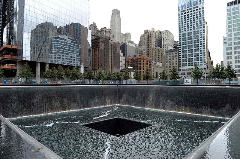 The World Trade Center North Tower memorial pool at the National September 11 Memorial and Museum is seen against the New York City skyline. The foundation that runs the memorial estimates that once the roughly $700 million project is complete, it will cost $60 million a year to operate.