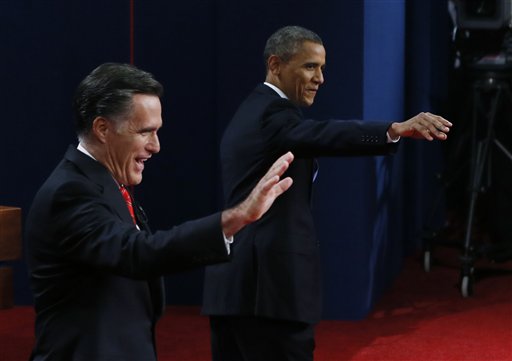Republican presidential nominee Mitt Romney and President Barack Obama wave during the first presidential debate at the University of Denver on Wednesday.