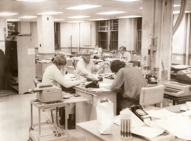 The Press Herald newsroom in the mid 1970s. From left are George Weir, D.C. Dreger, Ed Rice, and, Bob Bob Cummings. Typewriters and telephones are still in evidence. It wasn't until 1978 that the typewriters were replaced by a computerized electronic editing and production system.