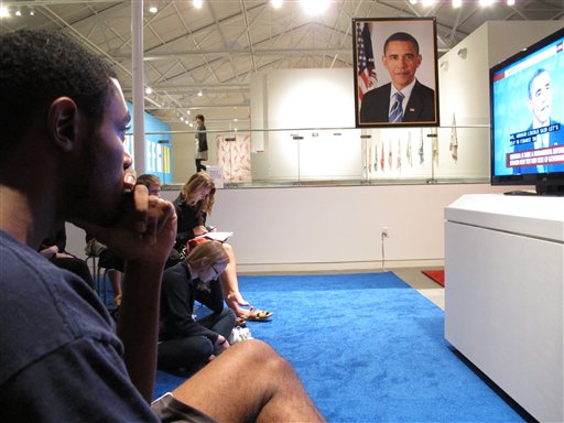 Drew Roston, 23, listens to Republican nominee Mitt Romney during a presidential debate event at the Contemporary Art Museum in Raleigh, N.C., on Wednesday, Oct. 3, 2012. Roston supports President Barack Obama but thought Romney had a strong performance. (AP Photo/Allen Breed)