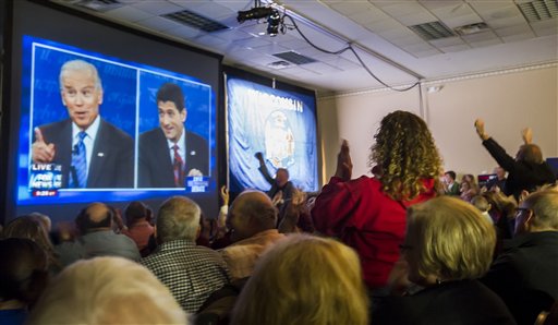 Supporters of Republican vice presidential nominee Rep. Paul Ryan, of Wisconsin, gather at the Holiday Inn Express in Janesville, Wis. to watch his debate with Vice President Joe Biden on Thursday, Oct. 11, 2012. (AP Photo/The Janesville Gazette, Mark Kauzlarich) Vice Presidential Debate;Janesville