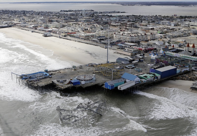 This aerial photo shows the damage to an amusement park left in the wake of superstorm Sandy on Wednesday, Oct. 31, 2012, in Seaside Heights, N.J. New Jersey got the brunt of Sandy, which made landfall in the state and killed six people. More than 2 million customers were without power as of Wednesday afternoon, down from a peak of 2.7 million. (AP Photo/Mike Groll) Superstorm Aerials