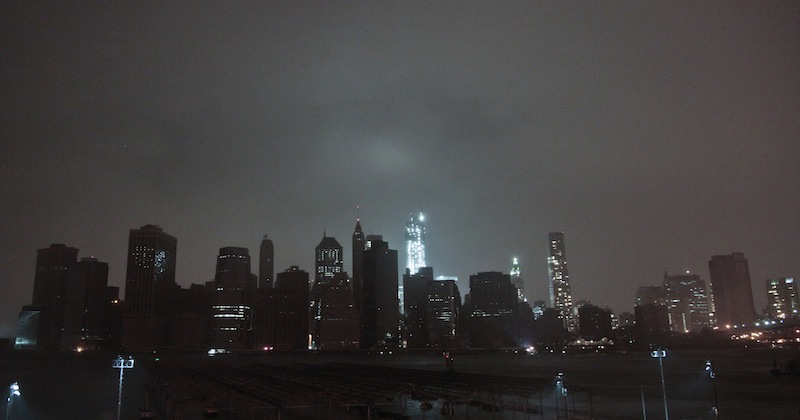 Lower Manhattan goes dark during the hybrid storm Sandy, on Monday, Oct. 29, 2012, viewed from the Brooklyn borough of New York. Authorities warned that New York City and Long Island could get the worst of the storm surge: an 11-foot onslaught of seawater that could swamp lower areas of the city. (AP Photo/Bebeto Matthews)