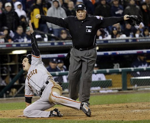 San Francisco Giants' Ryan Theriot reacts after scoring from second on a hit by Marco Scutaro during the 10th inning of Game 4 of the World Series against the Detroit. MLB