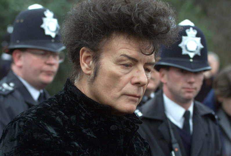 In this 2000 file photo, British performer Gary Glitter, attends a news conference in London.