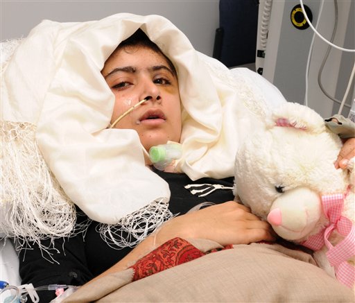 In this photo released on Friday, 15-year old Malala Yousufzai lies in a hospital bed at Queen Elizabeth Hospital in Birmingham, England.