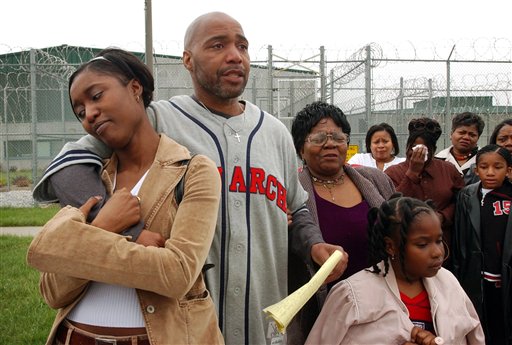 In this April 16, 2003, file photo, Terry Harrington, center, stands with his daughter Nicole Brown, left, his mother, Josephine James, right, and family and friends outside the Clarinda Correctional Facility in Clarinda, Iowa, after Gov. Tom Vilsack signed his reprieve. In a trial that starts this week, Harrington and Curtis McGhee, wrongfully convicted in the 1977 murder of a retired Iowa police officer, are suing the city of Council Bluffs, Iowa, and police officers they blame for forcing them to spend their adult lives in a state prison.