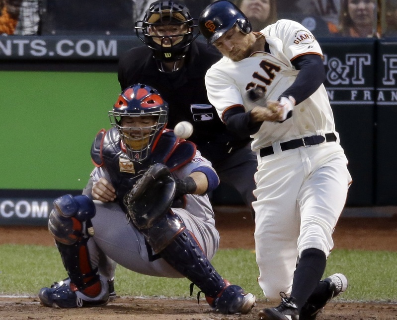 San Francisco Giants' Hunter Pence hits a three-run double during the third inning of Game 7 of the National League championship series against the St. Louis Cardinals on Monday in San Francisco.