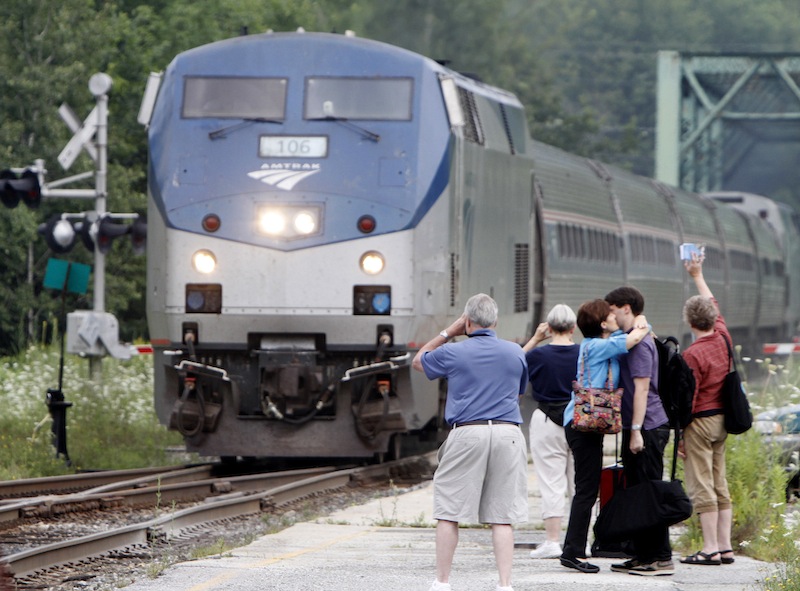 In this Aug. 3, 2010, file photo, people wait as the Amtrak Vermonter arrives in Montpelier, Vt. Amtrak has set new ridership records. The national high-speed rail operator says its trains carried more than 31 million passengers in the fiscal year ending Sept. 30. That marks the highest annual ridership total since Amtrak started operations in 1971. Records were set on Ethan Allen ridership between New York and Rutland, Vt., up 10 percent to more than 54,000 and the Vermonter from Washington to St. Albans, Vt., had 5.5 percent more passengers at 82,000.(AP Photo/Toby Talbot, File)