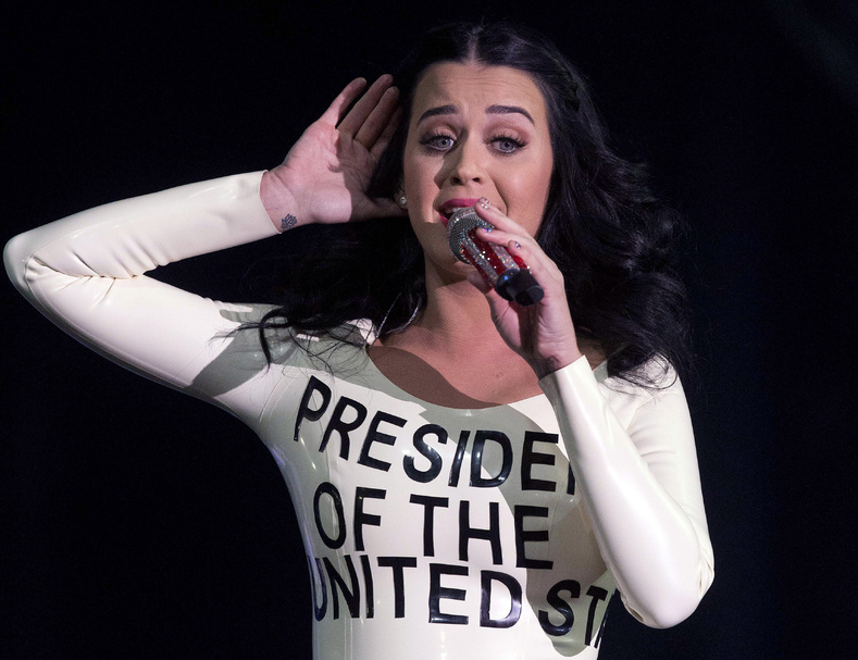 Singer Katy Perry, wearing a dress designed as a ballot, performs for a crowd before the arrival of President Obama at a rally Wednesday in Las Vegas.