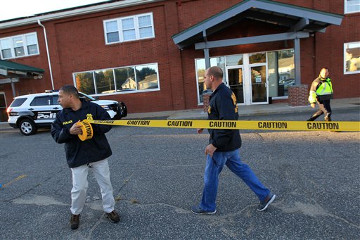 Federal agents investigate the offices of New England Compounding Center in Framingham, Mass., on Oct. 16, 2012. The company's steroid medication has been linked to a deadly meningitis outbreak.