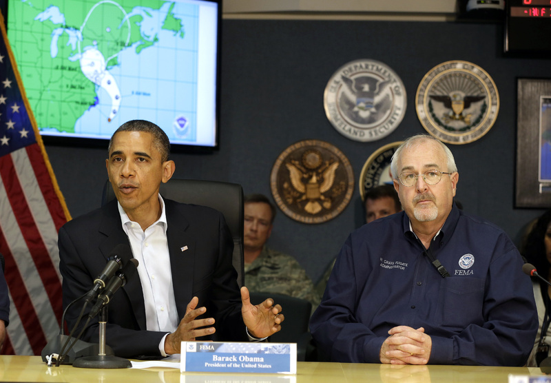 President Obama attends a briefing with Federal Emergency Management Agency administrator Craig Fugate, right, at the National Response Coordination Center at FEMA headquarters in Washington on Sunday.