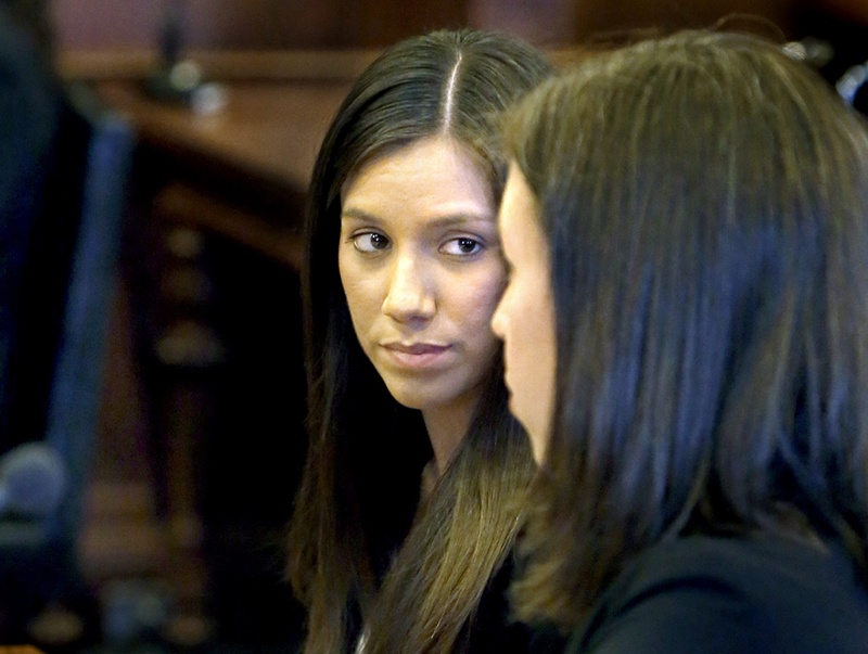 Alexis Wright, left, listens to her lawyer Sarah Churchill during Wright's arraignment Tuesday at the Cumberland County Courthouse in Portland. Wright and her business associate, Mark Strong Sr. of Thomaston pleaded not guilty to dozens of counts arising from an alleged prostitution operation in Kennebunk.
