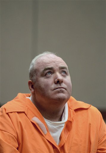 In this Jan. 24, 2012, photo, Michael Skakel listens to a statement from John Moxley, brother of victim Martha Moxley in court in Middletown, Conn. Skakel's first parole hearing is scheduled for Wednesday.