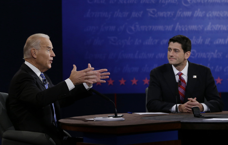 Republican vice presidential nominee Rep. Paul Ryan, of Wisconsin, right, listens as Vice President Joe Biden speaks during the vice presidential debate at Centre College, Thursday, Oct. 11, 2012, in Danville, Ky. (AP Photo/Eric Gay)