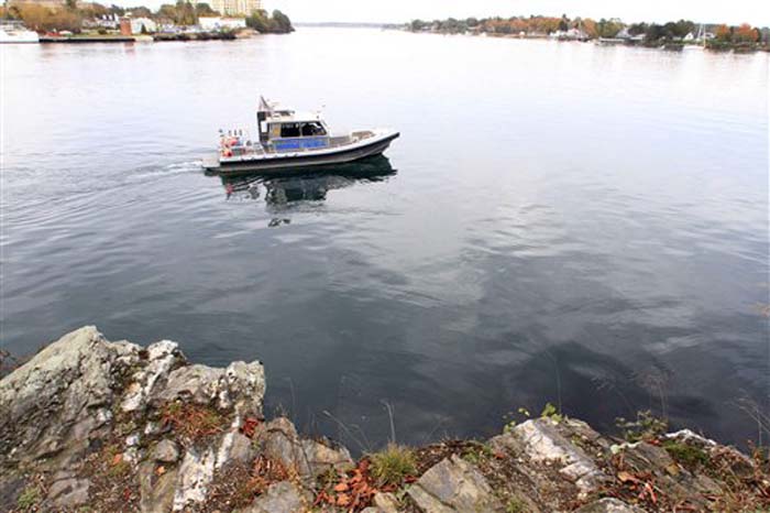 The New Hampshire Marine Patrol continues to search the Piscataqua River near a cliff on Pierce Island for the body Elizabeth "Lizzy" Marriott, a missing University of New Hampshire student on Monday, Oct. 15, 2012 in Portsmouth, N.H. Seth Mazzaglia, a 29-year-old martial arts instructor was held without bail Monday on a charge of strangling or suffocating Marriott, who vanished a week ago. (AP Photo/Jim Cole)