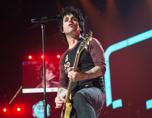 FILE - This Sept. 21, 2012 file photo released by Clear Channel shows Billie Joe Armstrong of Green Day performing at the 2012 iHeartRadio Music Festival at the MGM Grand Garden Arena in Las Vegas, Nev. Green Day announced Monday, Oct. 29, 2012, they will cancel their club tour that was due to launch in Seattle at the Paramount Theatre on Sept. 26 and wind down in Tempe, Ariz., at the Marquee Theatre on Dec. 10. The announcement comes over a month after the band's front man Billie Joe Armstrong headed into treatment for substance abuse. (AP Photo/Clear Channel, Andrew Swartz, file)
