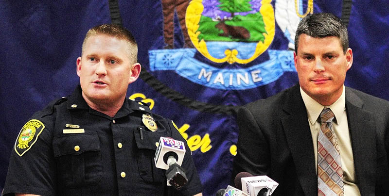 Augusta Deputy Police Chief Jared Mills, left, and state police Lt. Chris Coleman answer questions on Tuesday afternoon in Augusta about the arrest in Seattle of Gary Raub, 63, who allegedly stabbed a 70-year-old Augusta woman to death in 1976.
