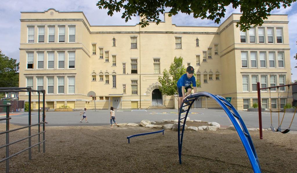 Children enjoy the playground in back of Nathan Clifford School on Falmouth Street in Portland in this 2010 photo.
