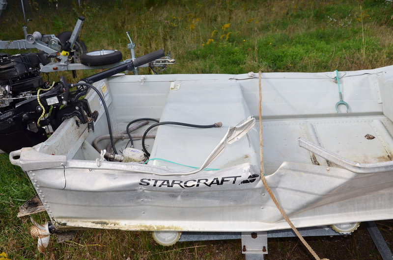 A 14-foot aluminum skiff shows damage from the fatal collision with a cabin cruiser near Littlejohn Island on Sept. 21.