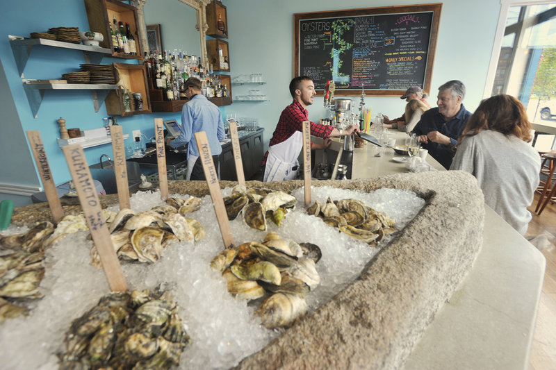 At Eventide Oyster Co., wooden sticks mark the varieties like a bivalve garden plot. Diners can try a half- or full dozen ($15 and $27), grouped by “Maine” and “From Away,” accompanied by Mimosa Mignonette, Tomato Water or Horseradish Ice.