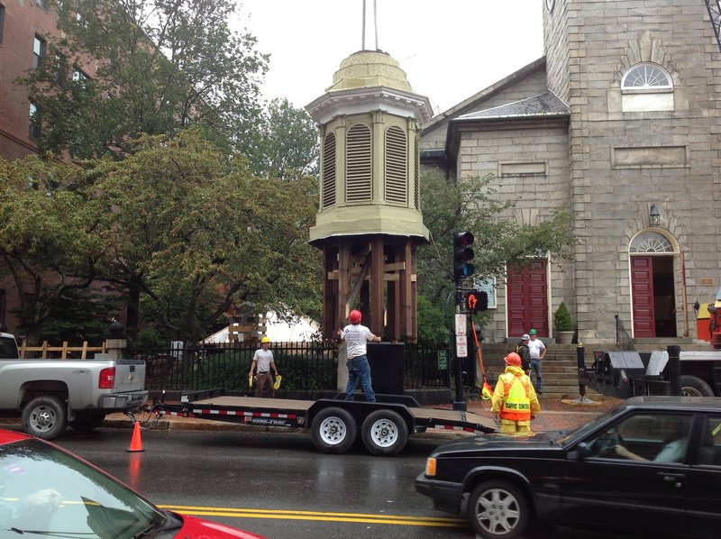 A section of the steeple of the historic First Parish Unitarian Universalist Church on Congress Street in Portland is lowered Wednesday. It will be restored this winter by steeplejacks in Vermont.