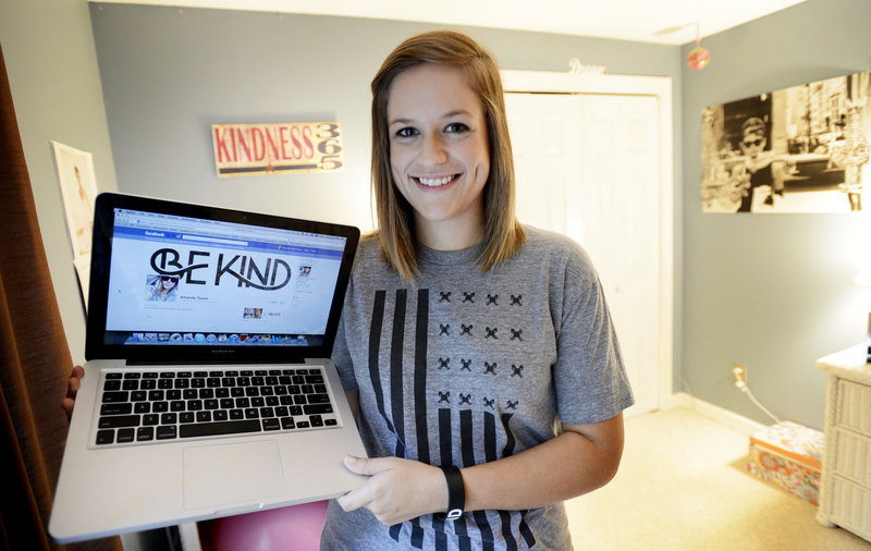 Amanda Tyson of Scarborough, who has struggled with the effects of bullying since she was a sixth-grader in Scarborough, shows off her Facebook page where she spreads her “Be Kind” anti-bullying message. Her page now has more than 56,000 fans. “I never, ever in a million years imagined myself as a role model,” she said.