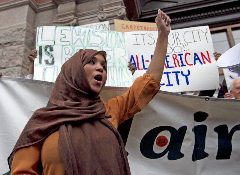 Community advocate Nimo Yonis leads a protest chant against the mayor of Lewiston, Maine, Thursday, Oct. 4, 2012. Critics of the mayor delivered petitions asking for his resignation because of comments he made about Somali refugees in his city. (AP Photo/Robert F. Bukaty)