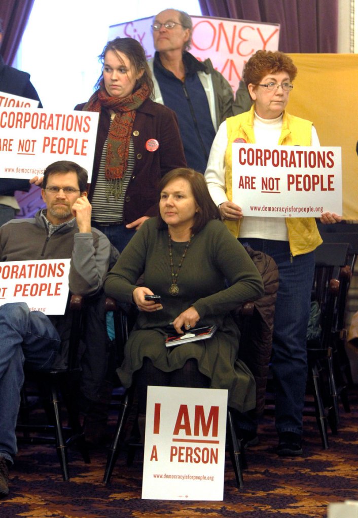 On the anniversary of the Citizens United ruling in January, people at a Burlington, Vt., rally hold signs calling for a constitutional amendment overturning the ruling.