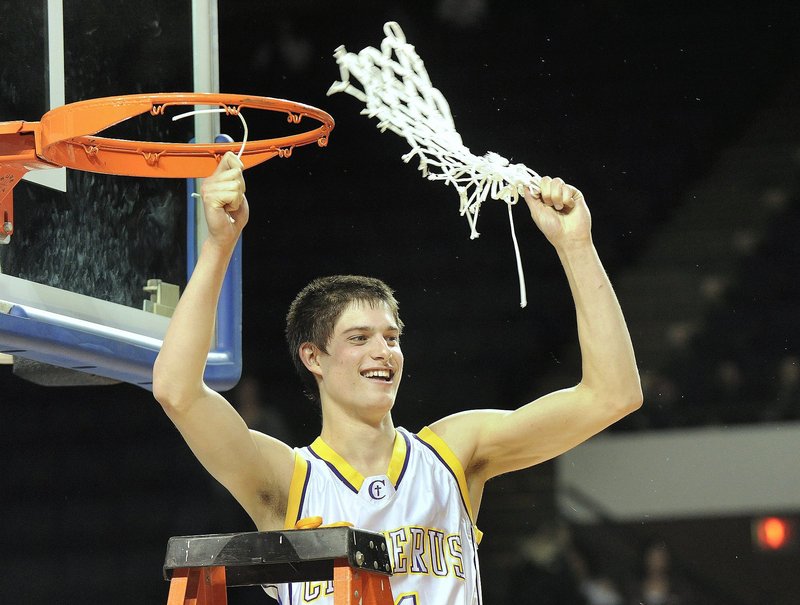 Then-team captain Indiana Faithfull twirls the net following Cheverus’ win over Edward Little in the Boys Class A State Championship basketball game Feb. 27, 2010.